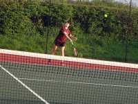 A serve with follow through to club rules